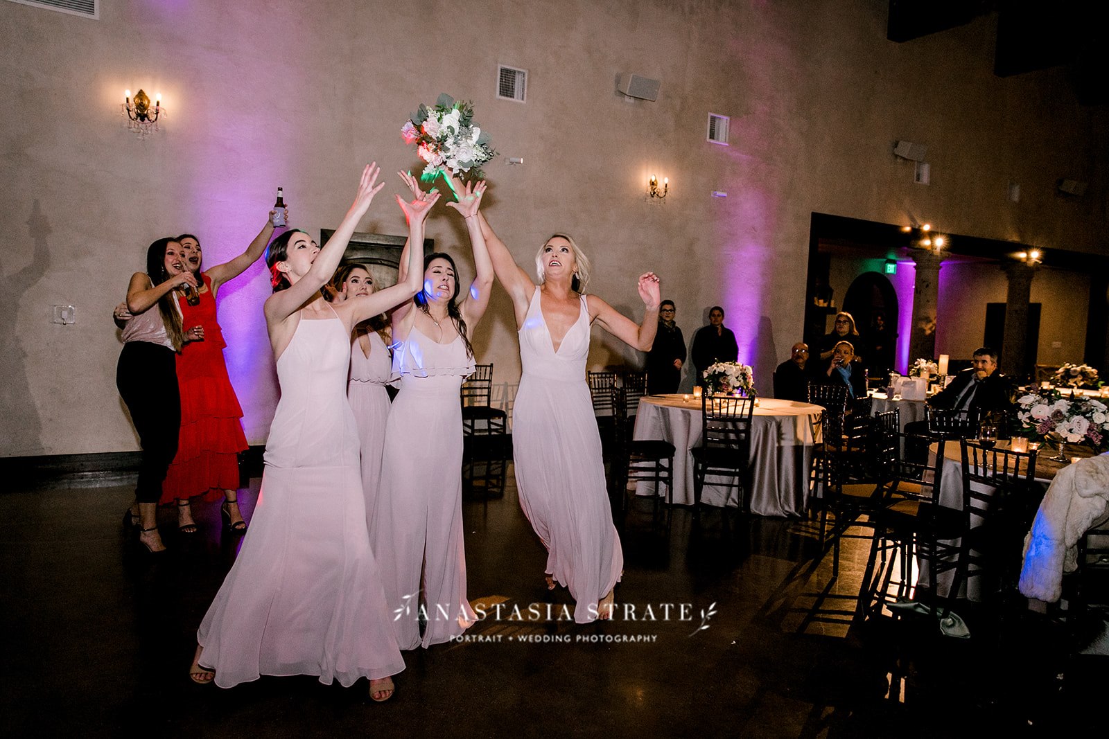 bridesmaids catching the bouquet