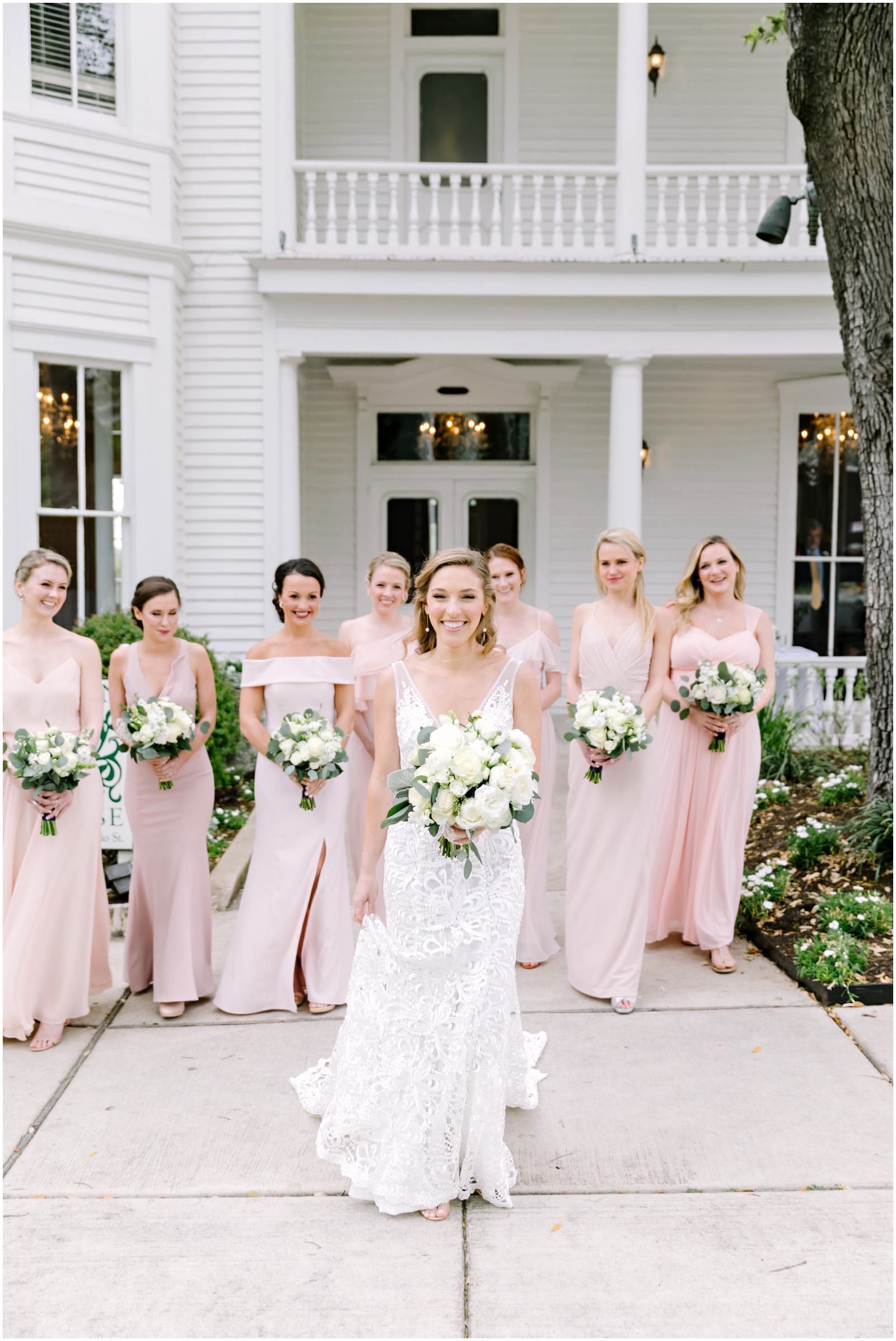 bride with her bridesmaids before her Texas wedding
