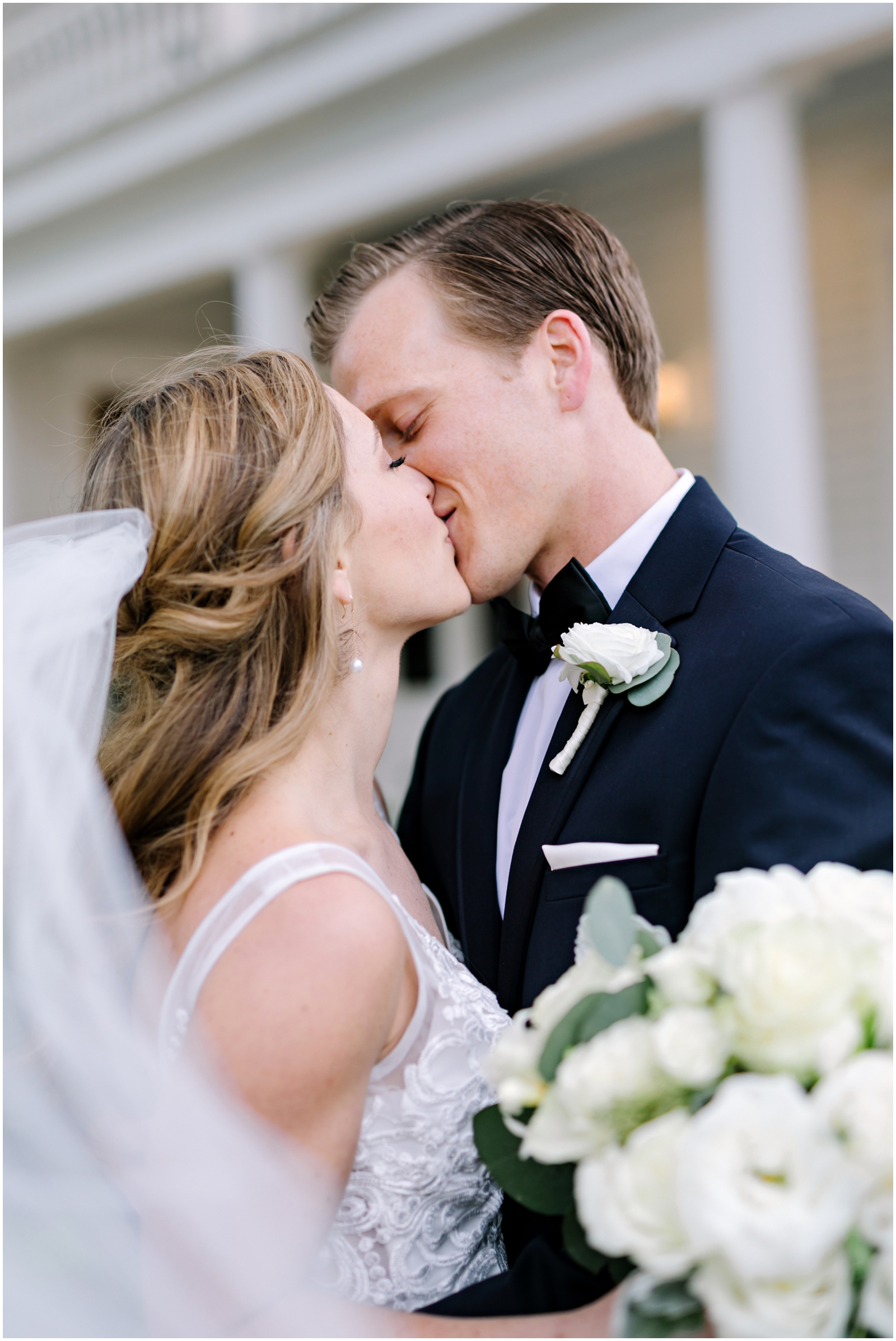 Bride and groom kiss