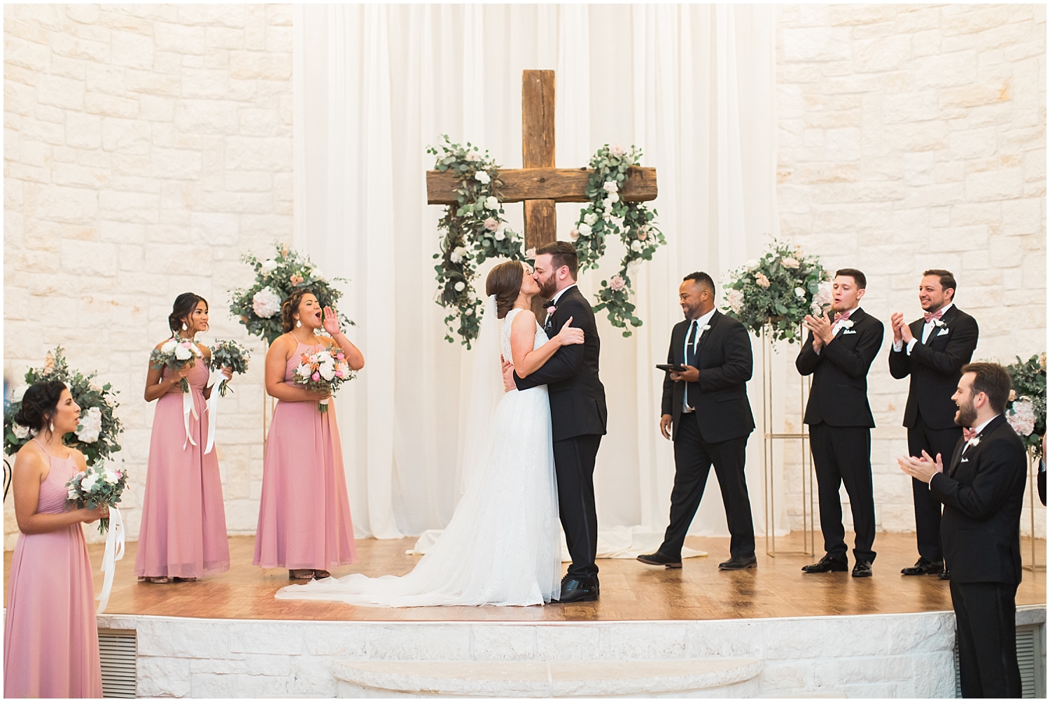  Bride and groom kiss at their Houston wedding ceremony 