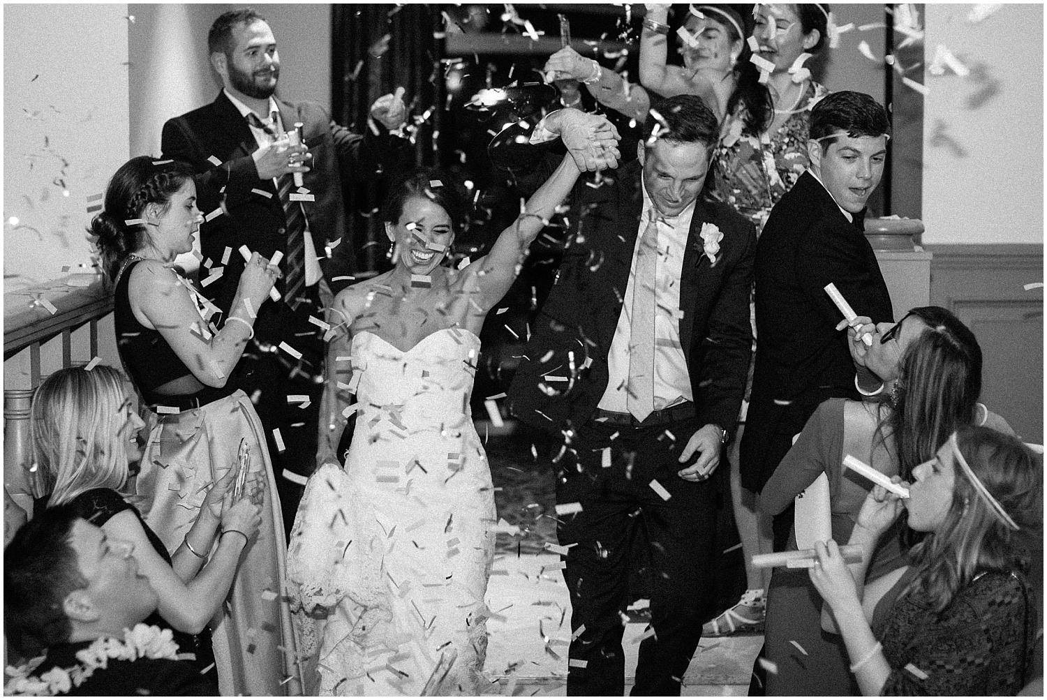 the bride and groom’s grand entrance with confetti thrown
