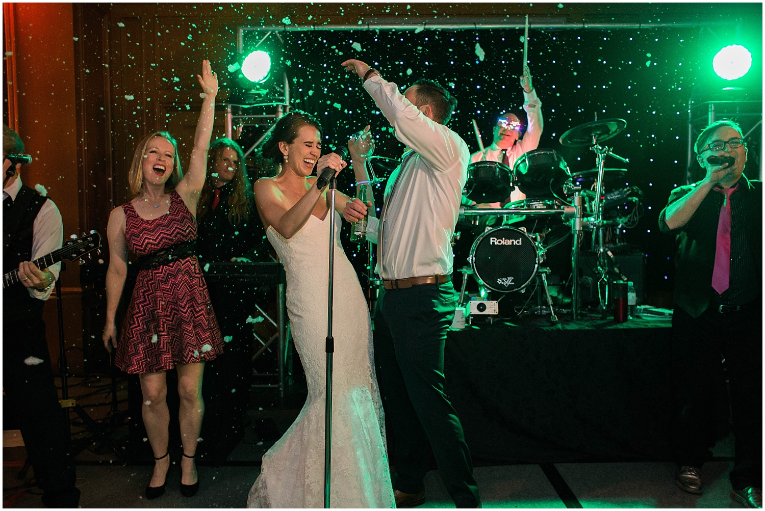 the bride and groom singing on stage