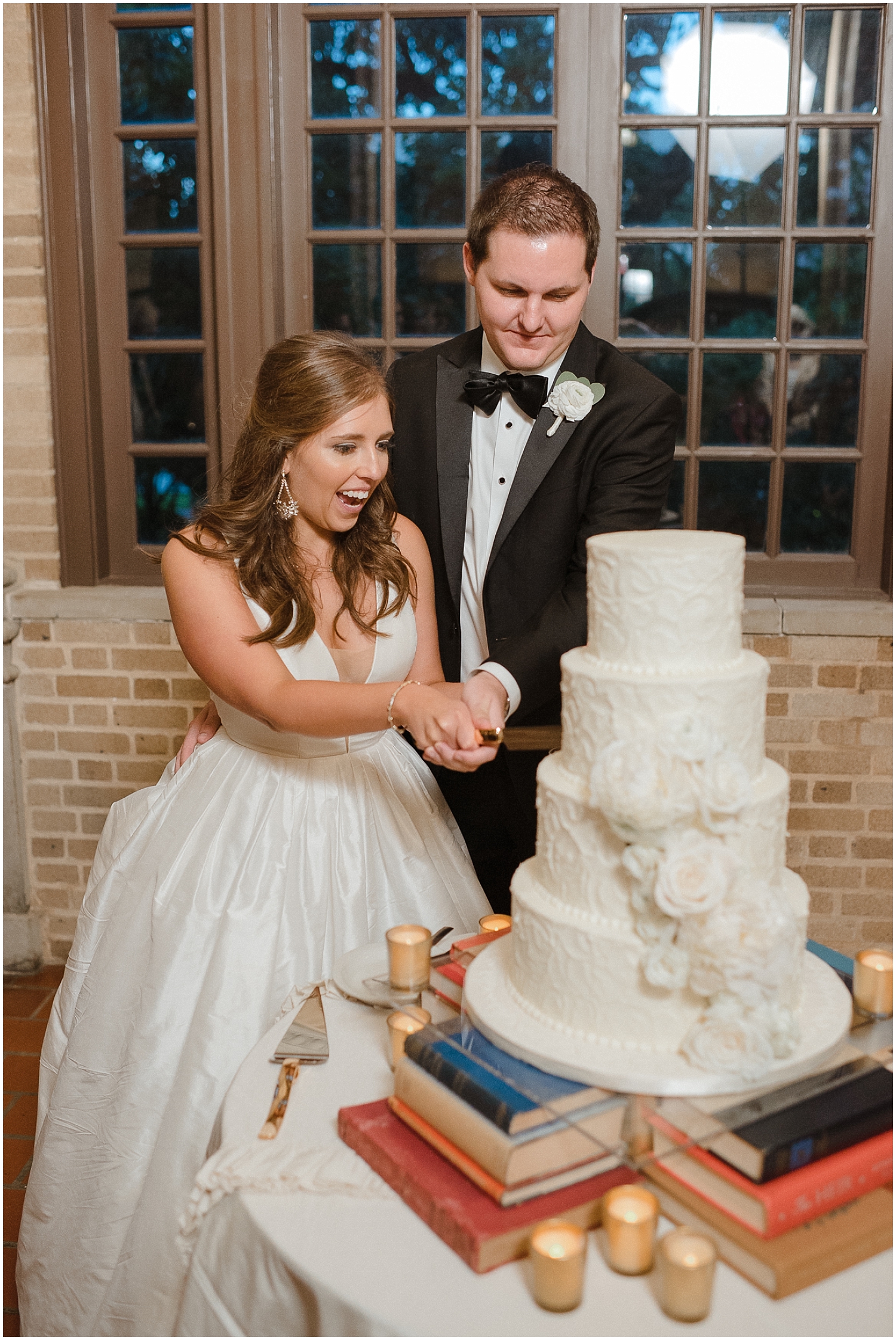  the bride and groom cut their wedding cake 