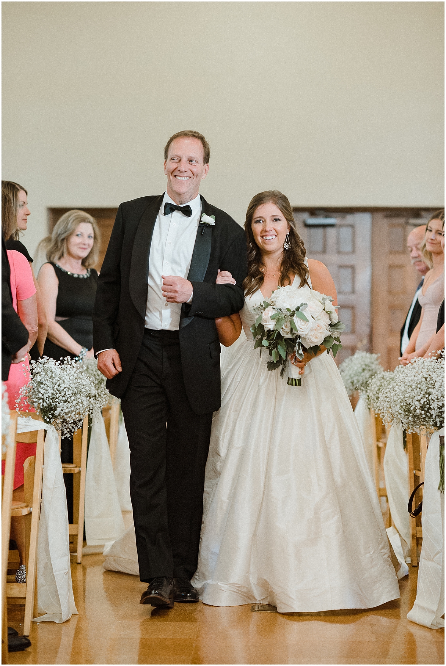 bride walking down the aisle at her wedding ceremony