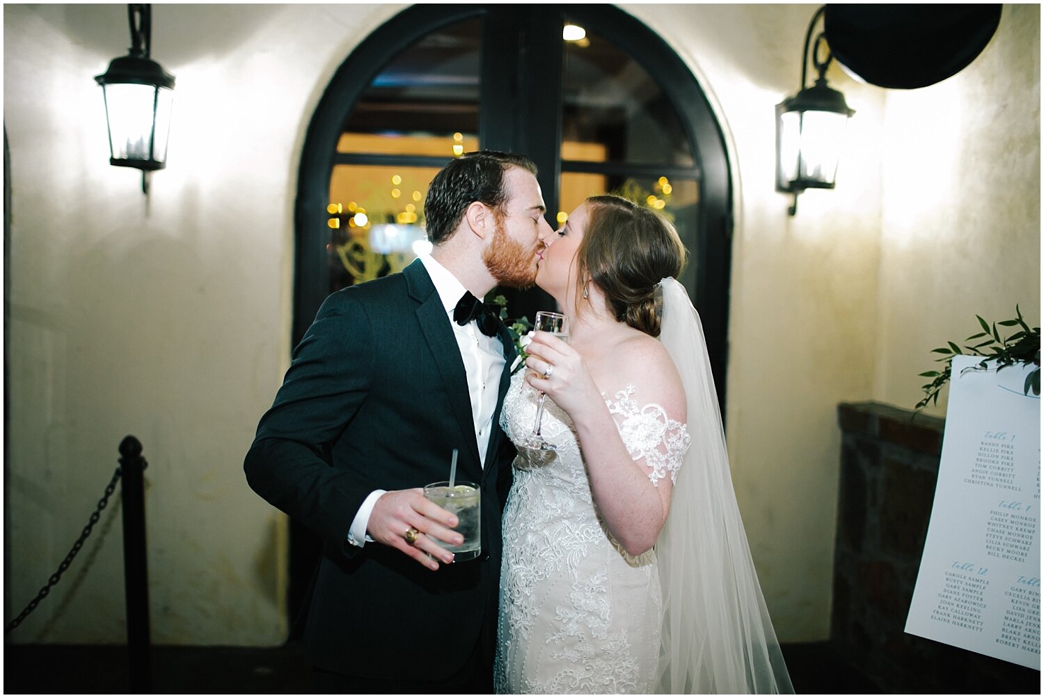  bride and groom kiss at their wedding reception 