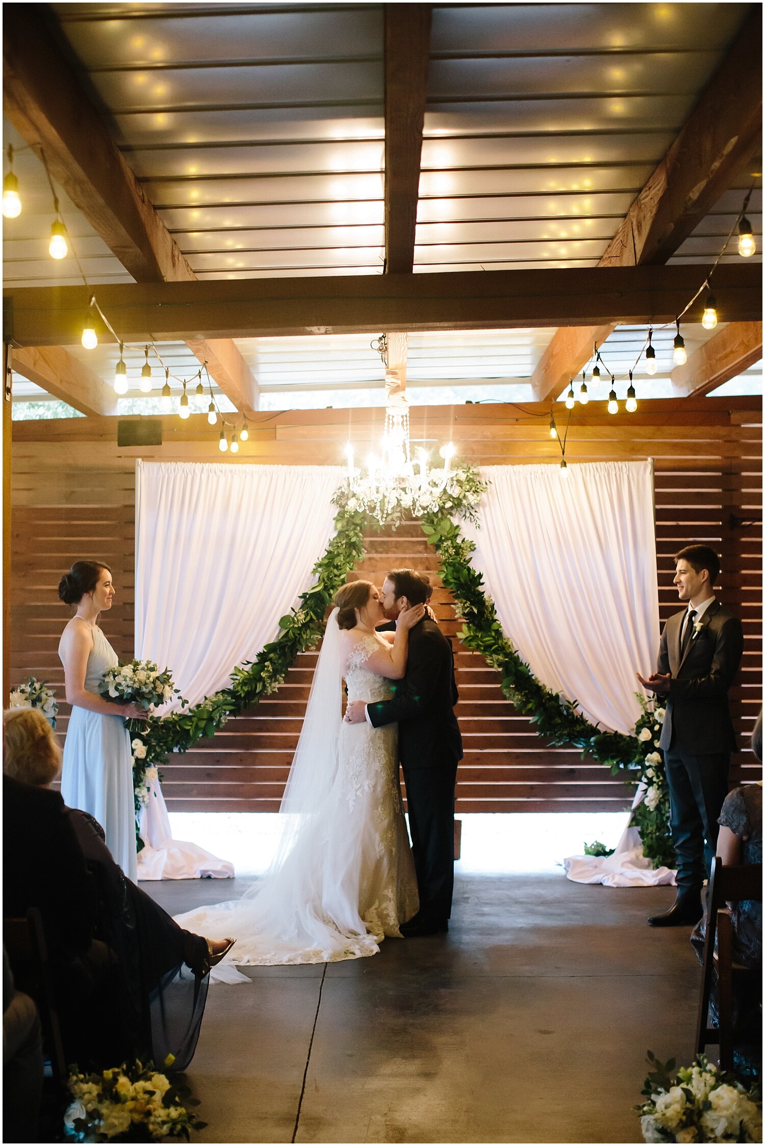  Bride and groom kiss at their Austin wedding ceremony 