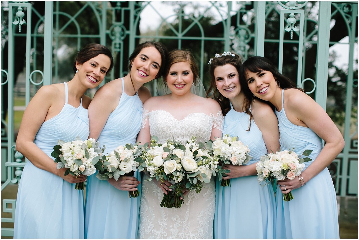  bride and bridesmaids holding their bridal bouquets 