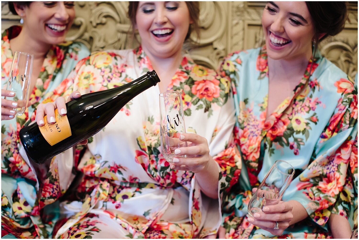  bride and bridesmaids pouring some wine before the Austin wedding 