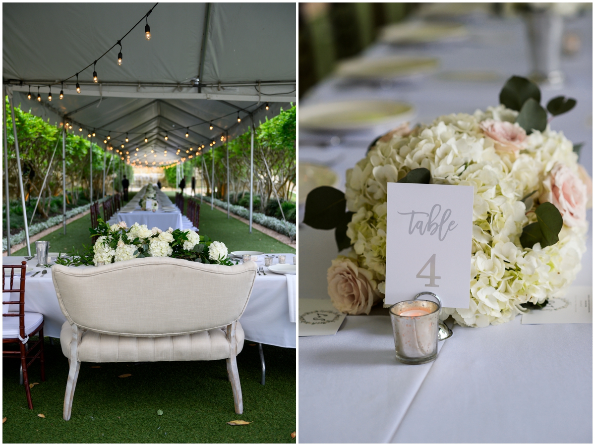 table signs and white floral wedding centerpieces 