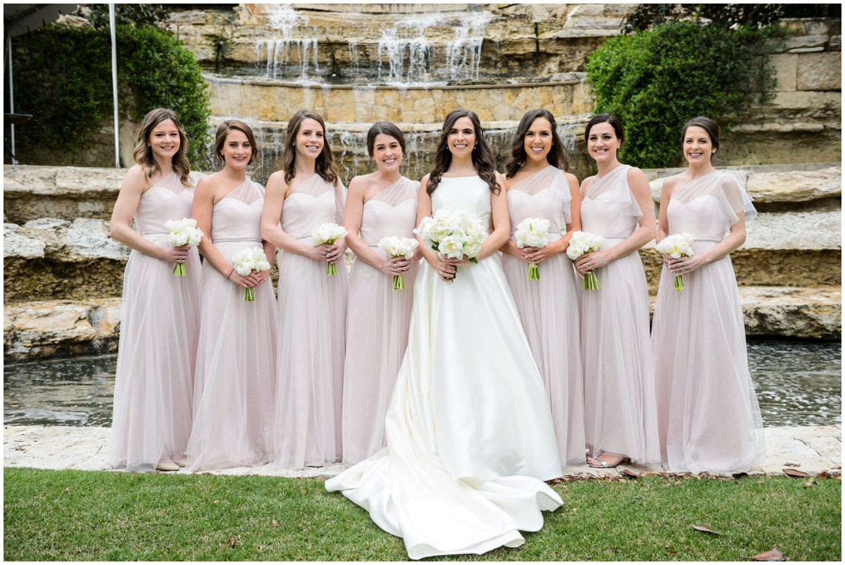  bride and the bridesmaids holding their bridal bouquets 