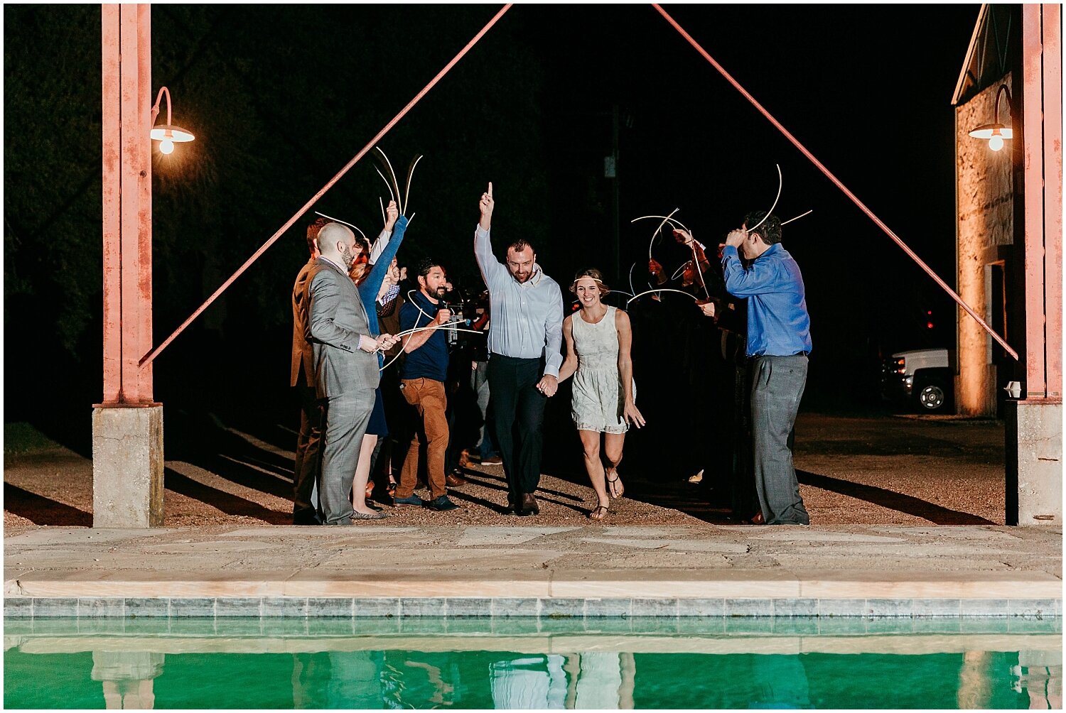  bride and groom jump into a pool for their grand exit 