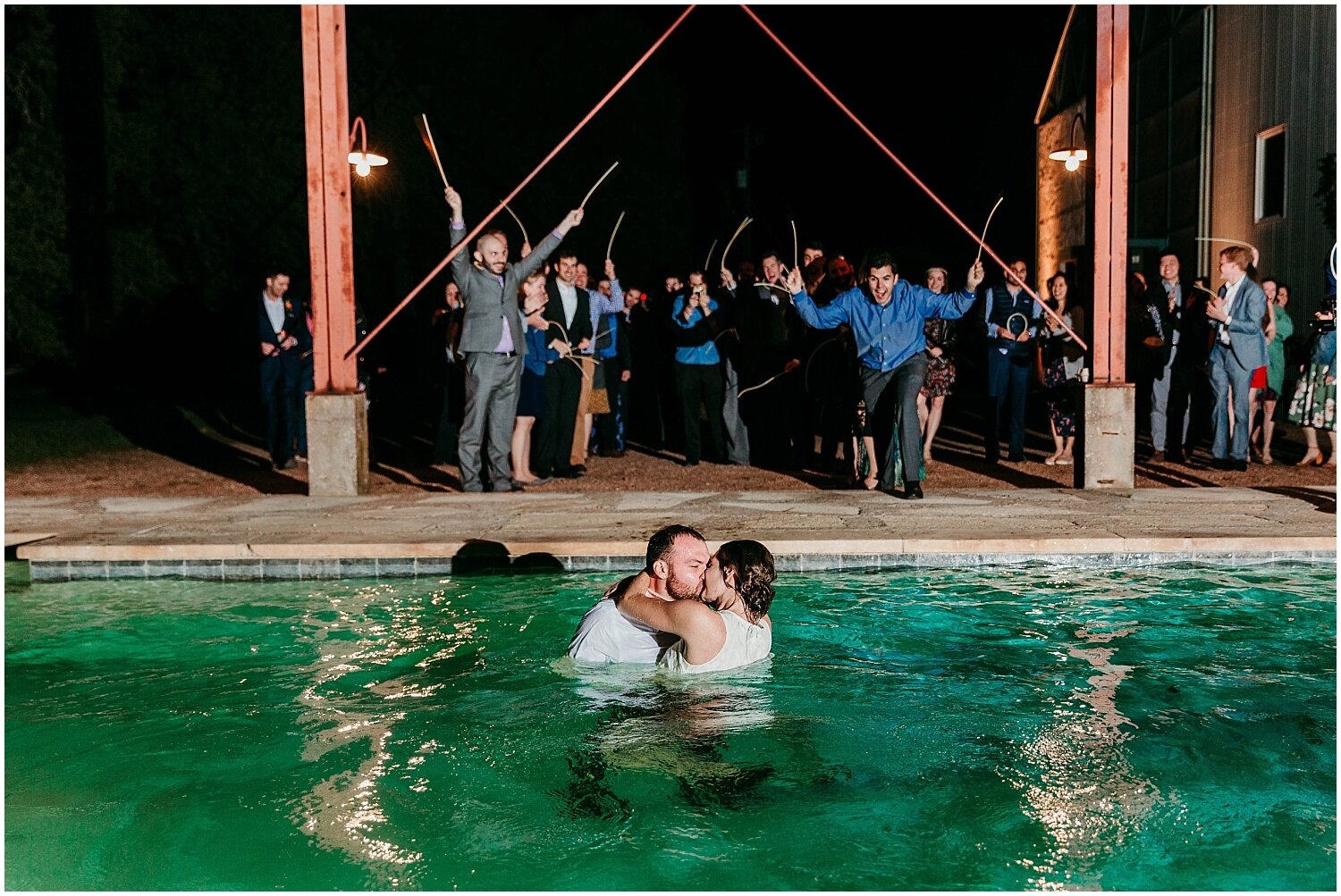  bride and groom jump into the pool 