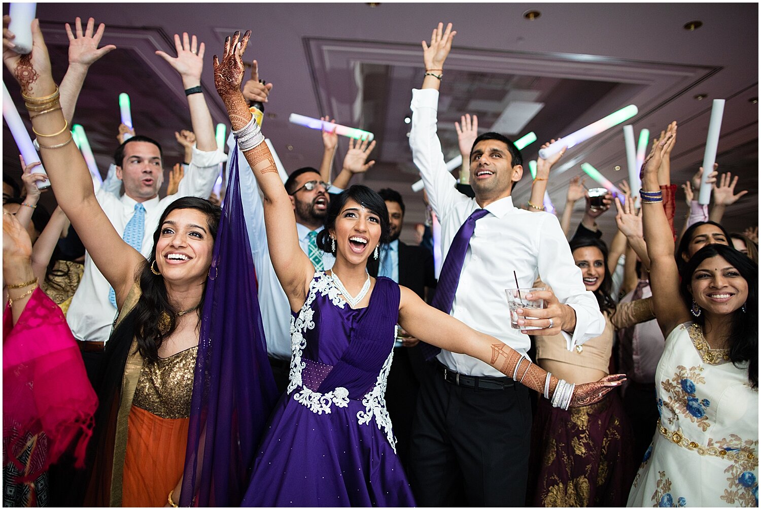  wedding guests having a blast at Indian wedding 