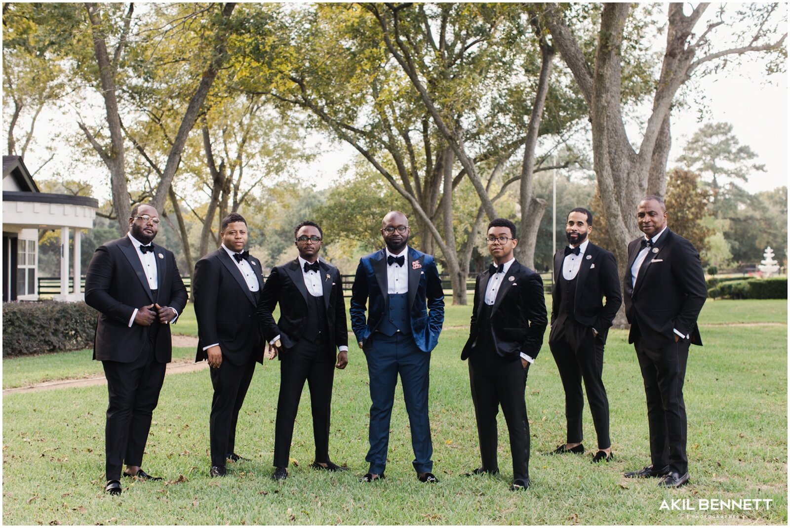  groom and groomsmen posing before the wedding 
