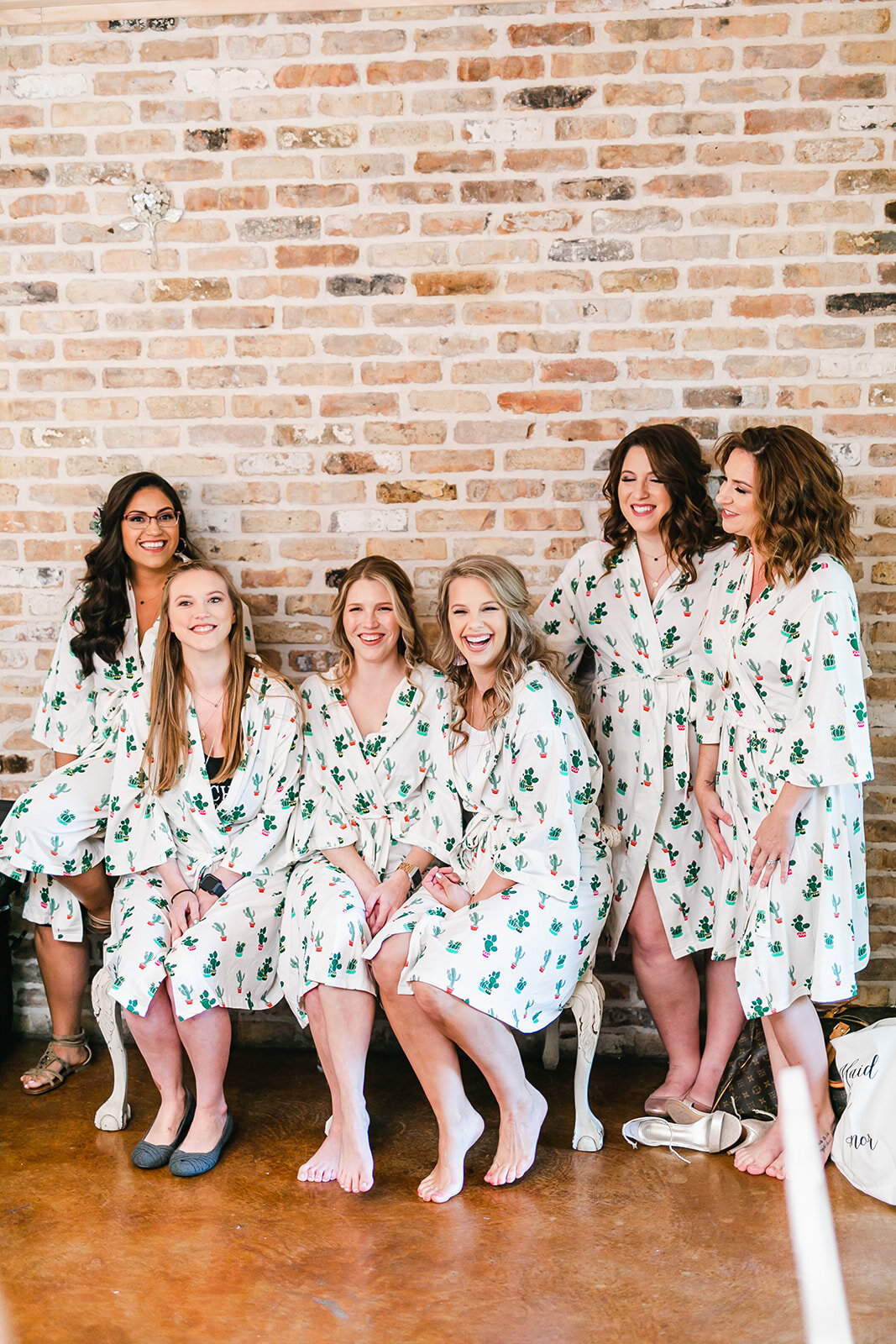  bride and bridesmaids smiling before the wedding 