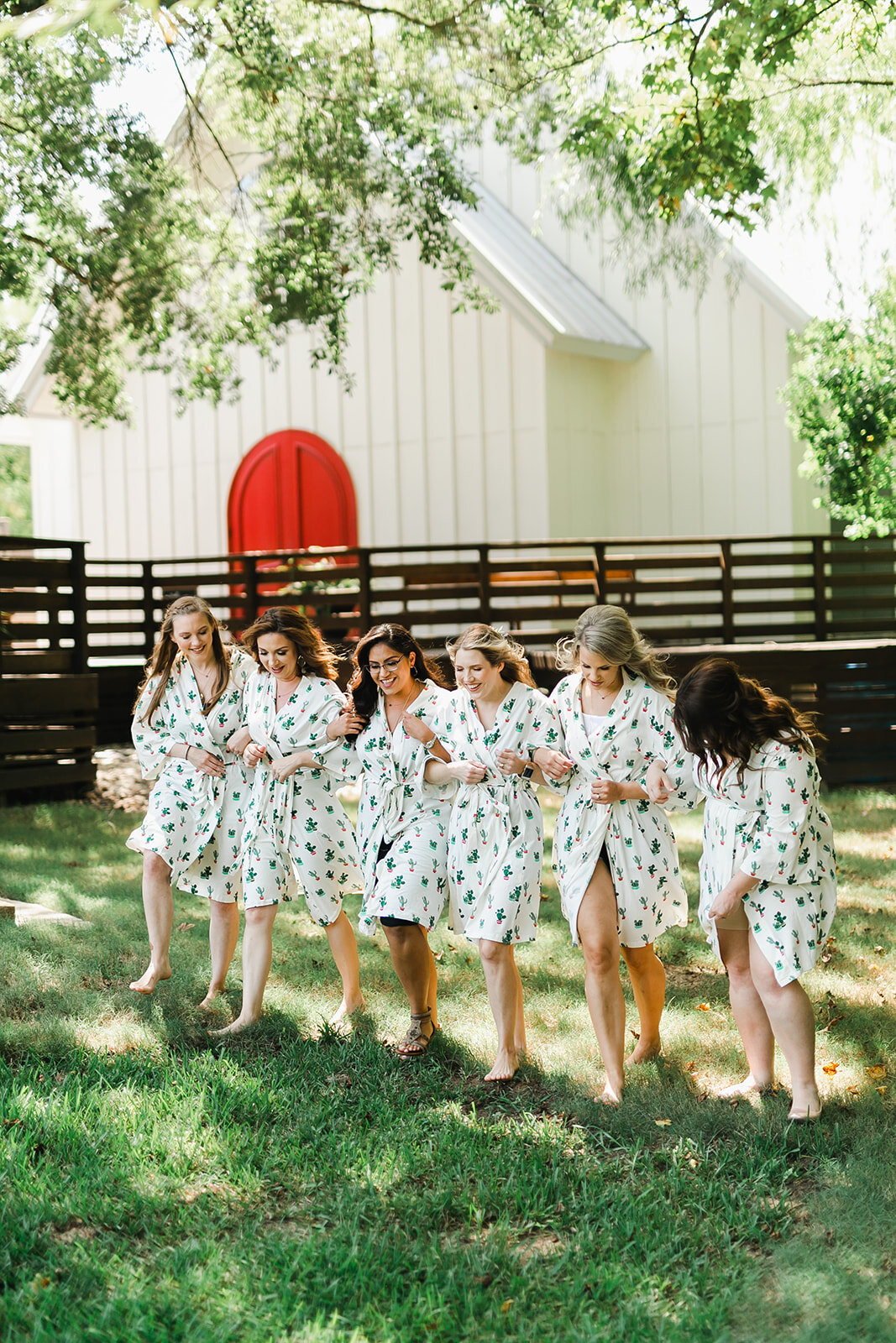  bride and bridesmaids wearing cute bathrobes before the wedding 