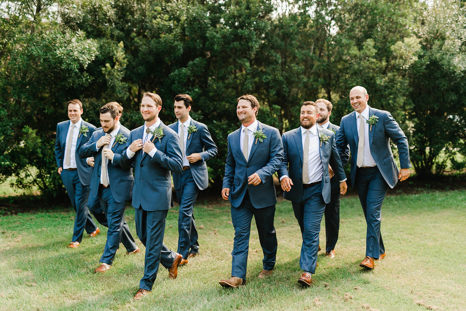  groom walking with the groomsmen 