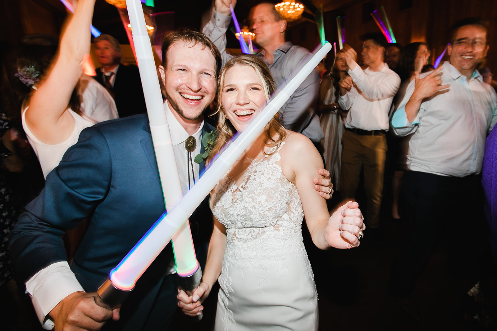  bride and groom with light saber lights 
