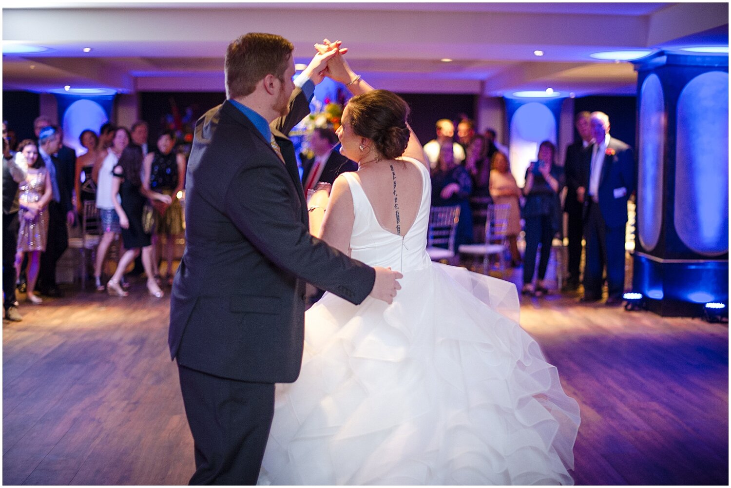  bride and groom having their first dance 