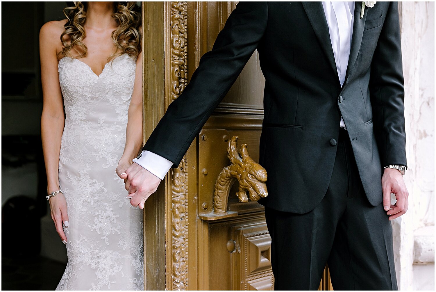  bride and groom hold hands before the wedding 