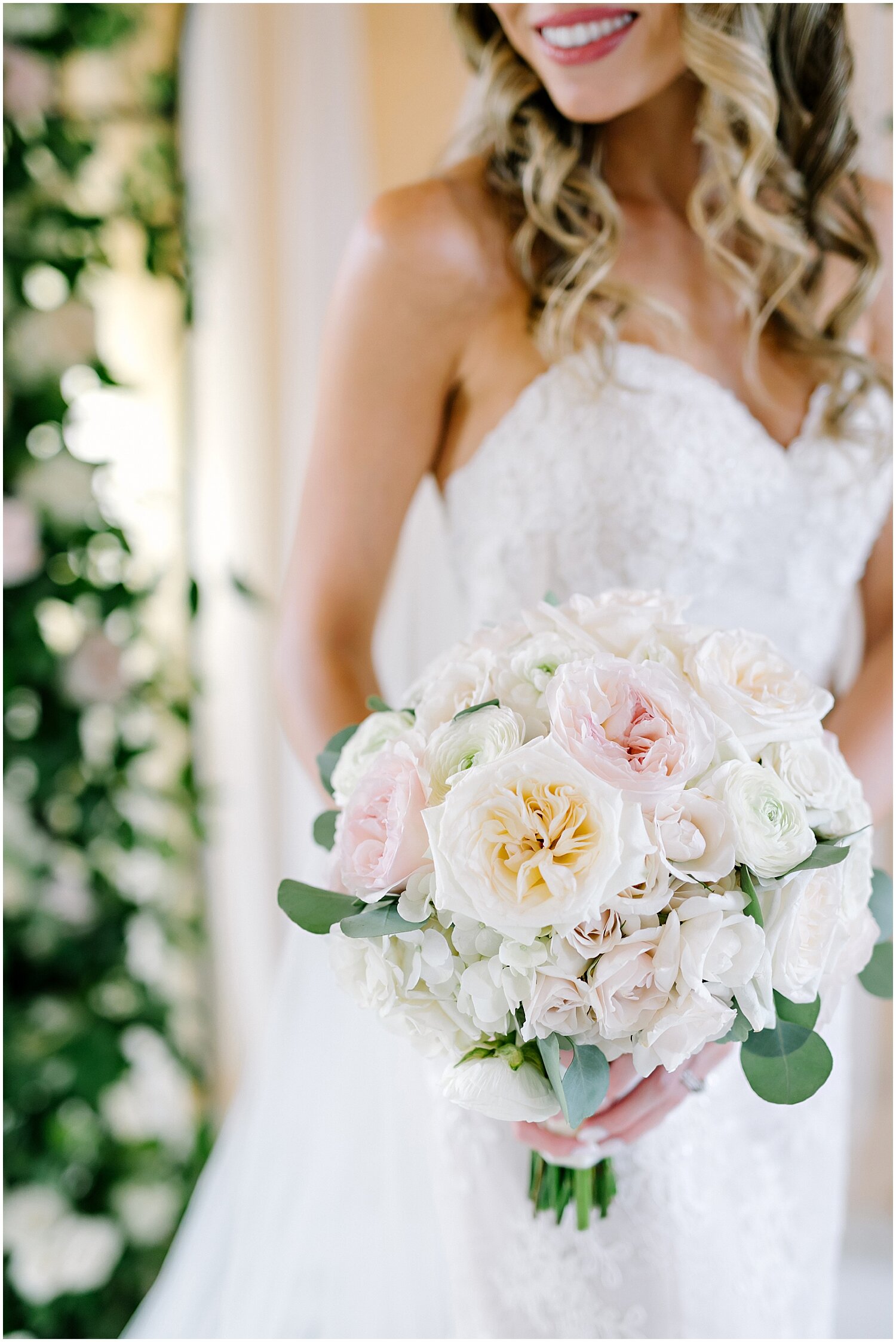  bride holding her white and peach bridal bouquet 