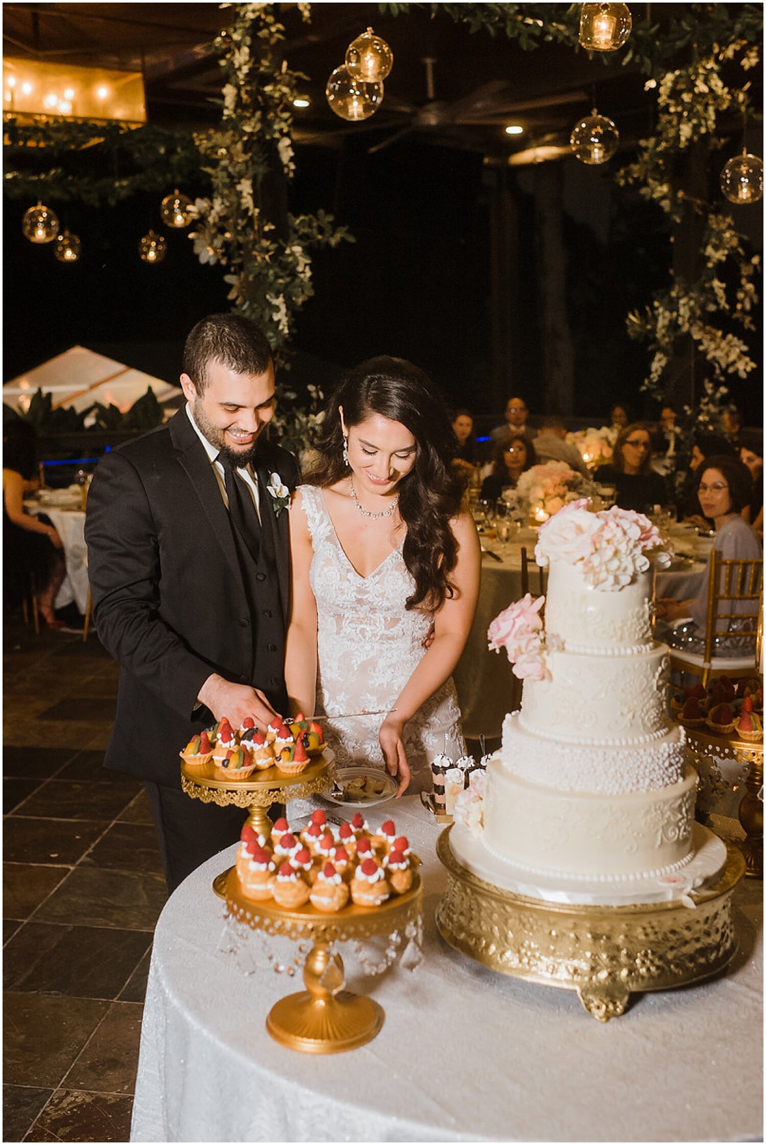  bride and groom cut their wedding cake 