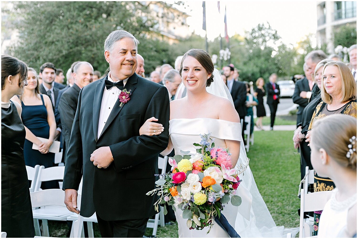  father and bride walking down the aisle 