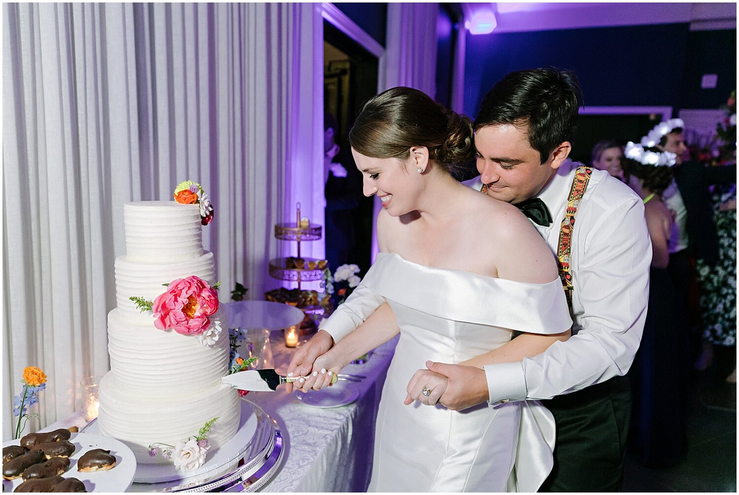  bride and groom cut their wedding cake 