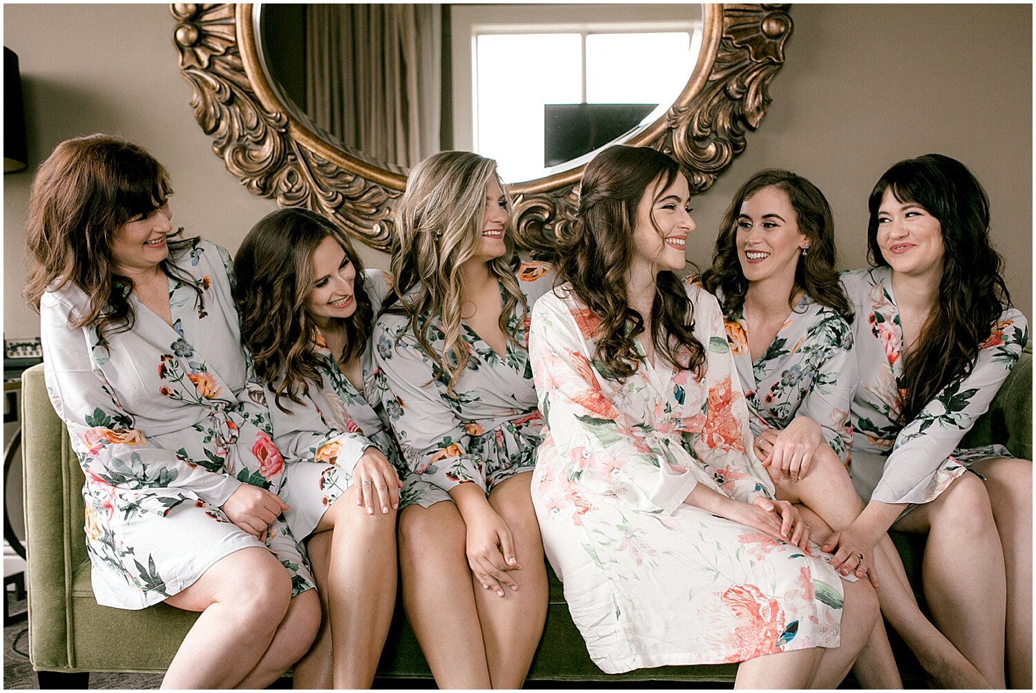  bride and bridesmaids wearing their bath robes 