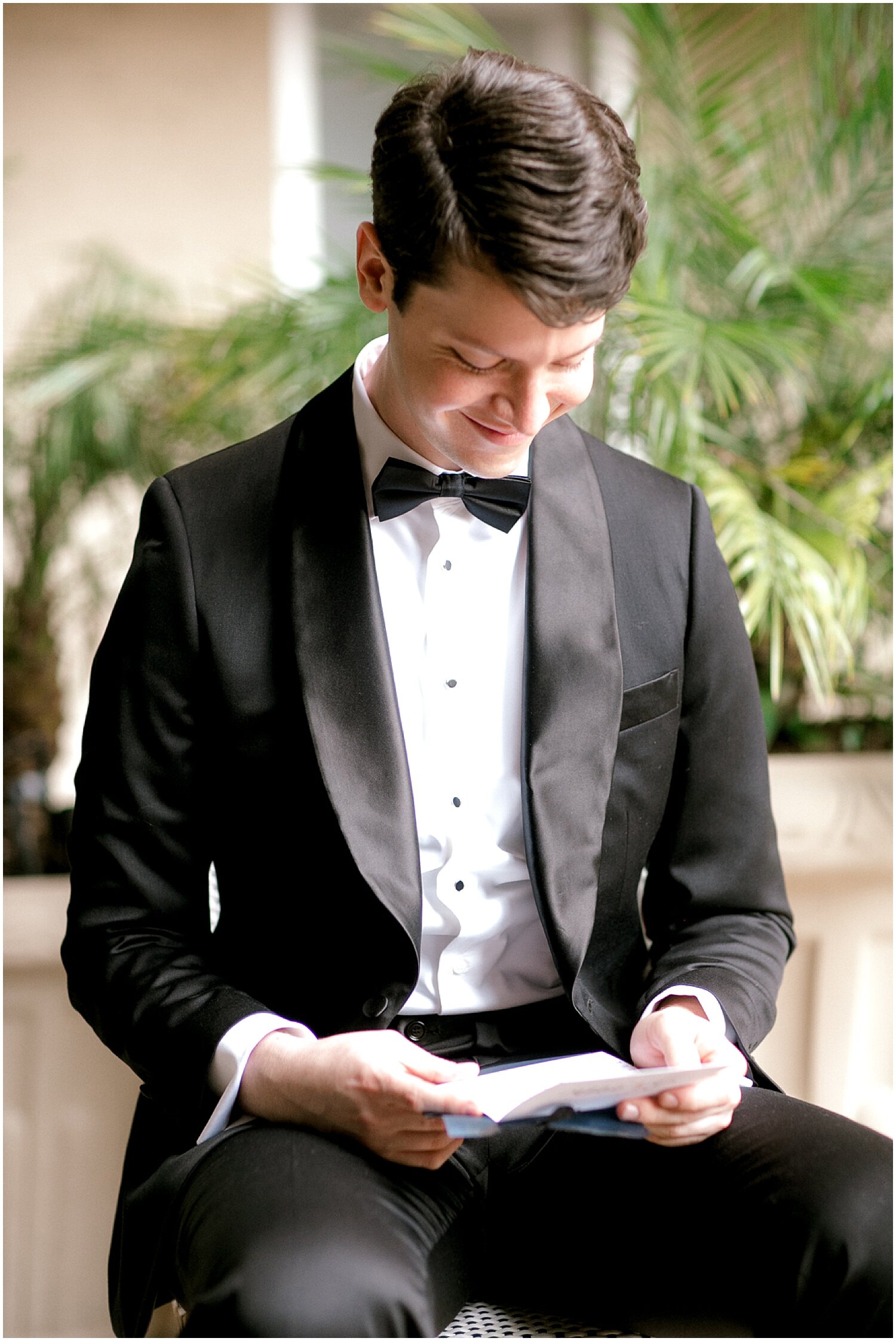  groom reading a letter from his bride 