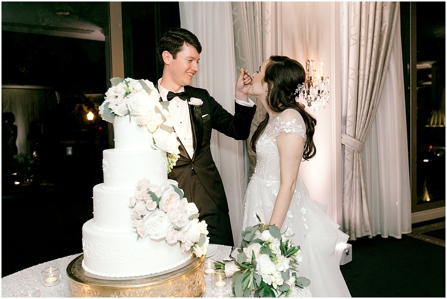  bride and groom cutting their wedding cake 