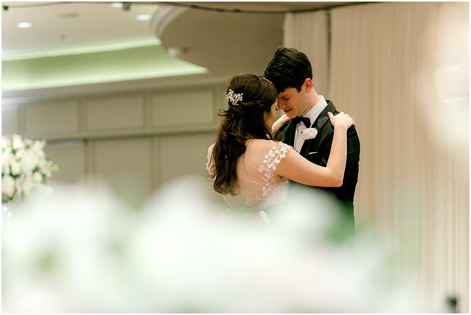  bride and groom dancing alone in their wedding reception 