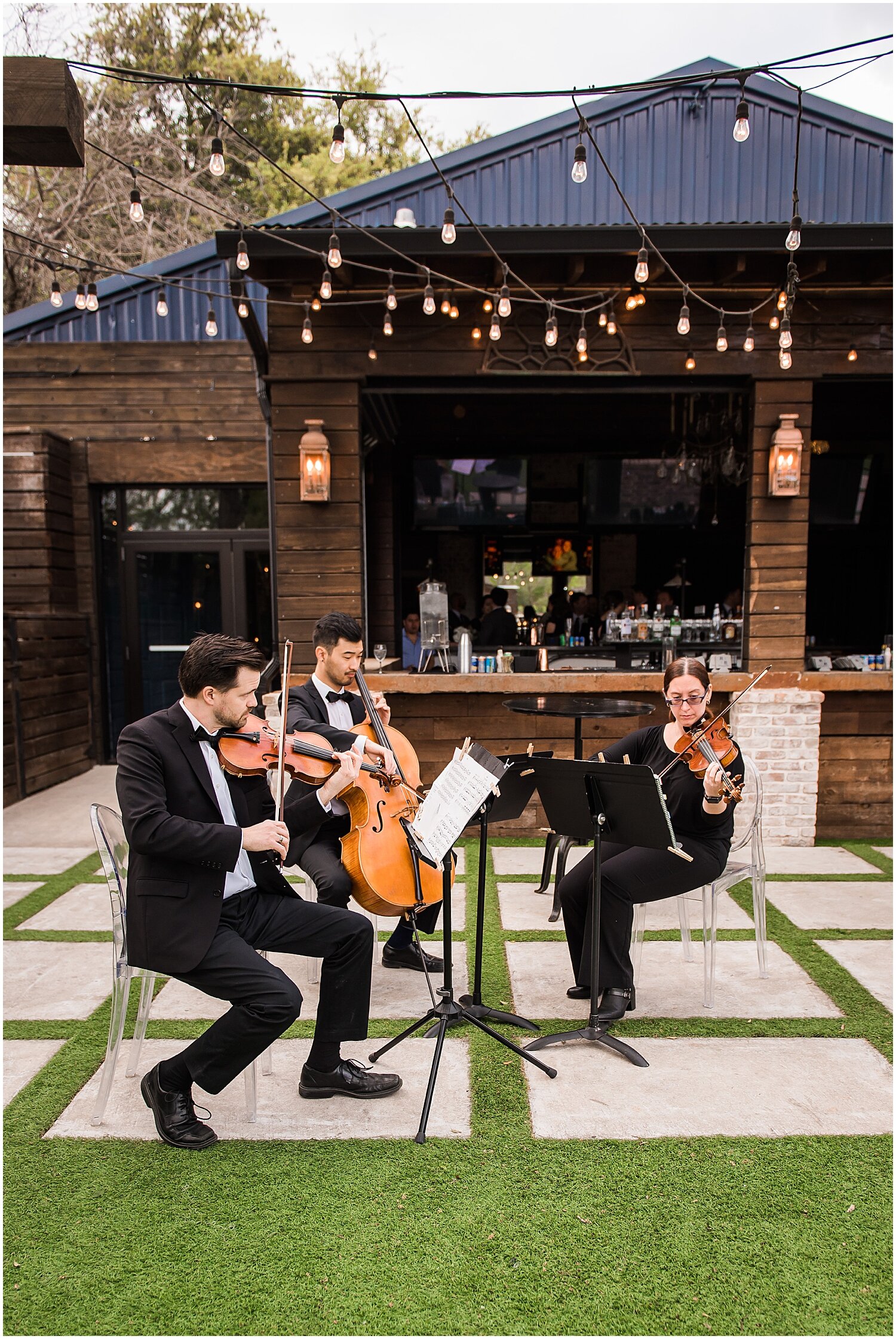  string musicians playing during the wedding ceremony 