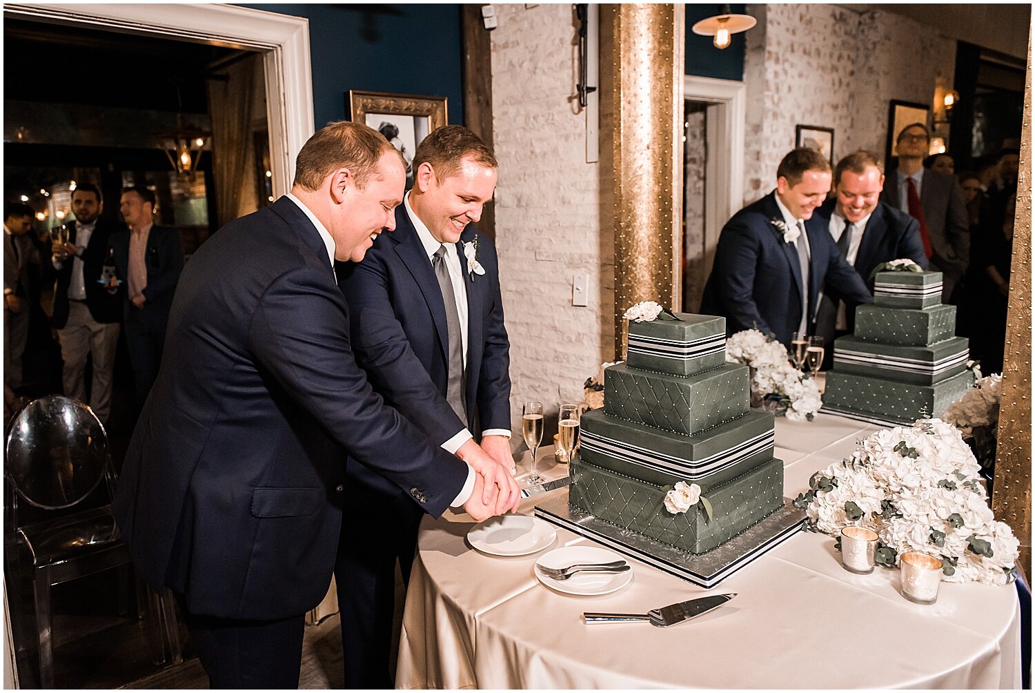  the grooms cutting their wedding cake 