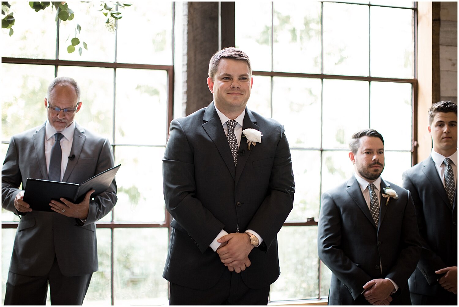  groom watching the bride walk down the aisle 