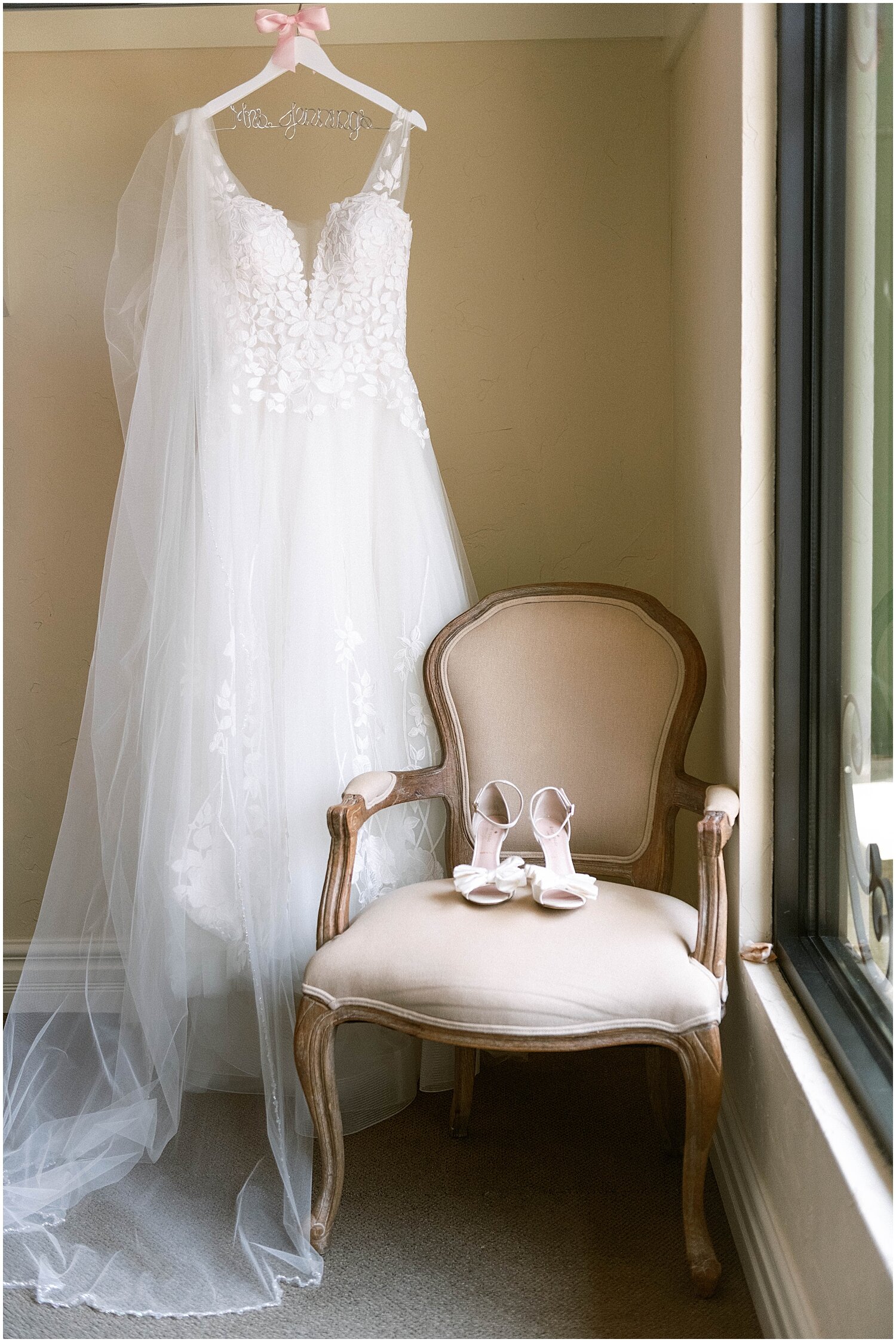  bride’s wedding dress hung up before the wedding 