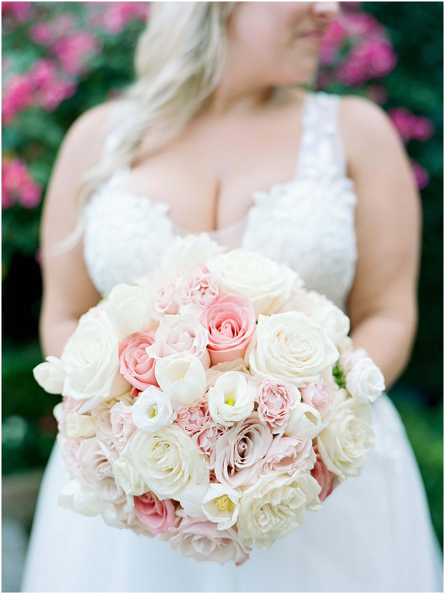  bride holding her white and peach bridal bouquet 