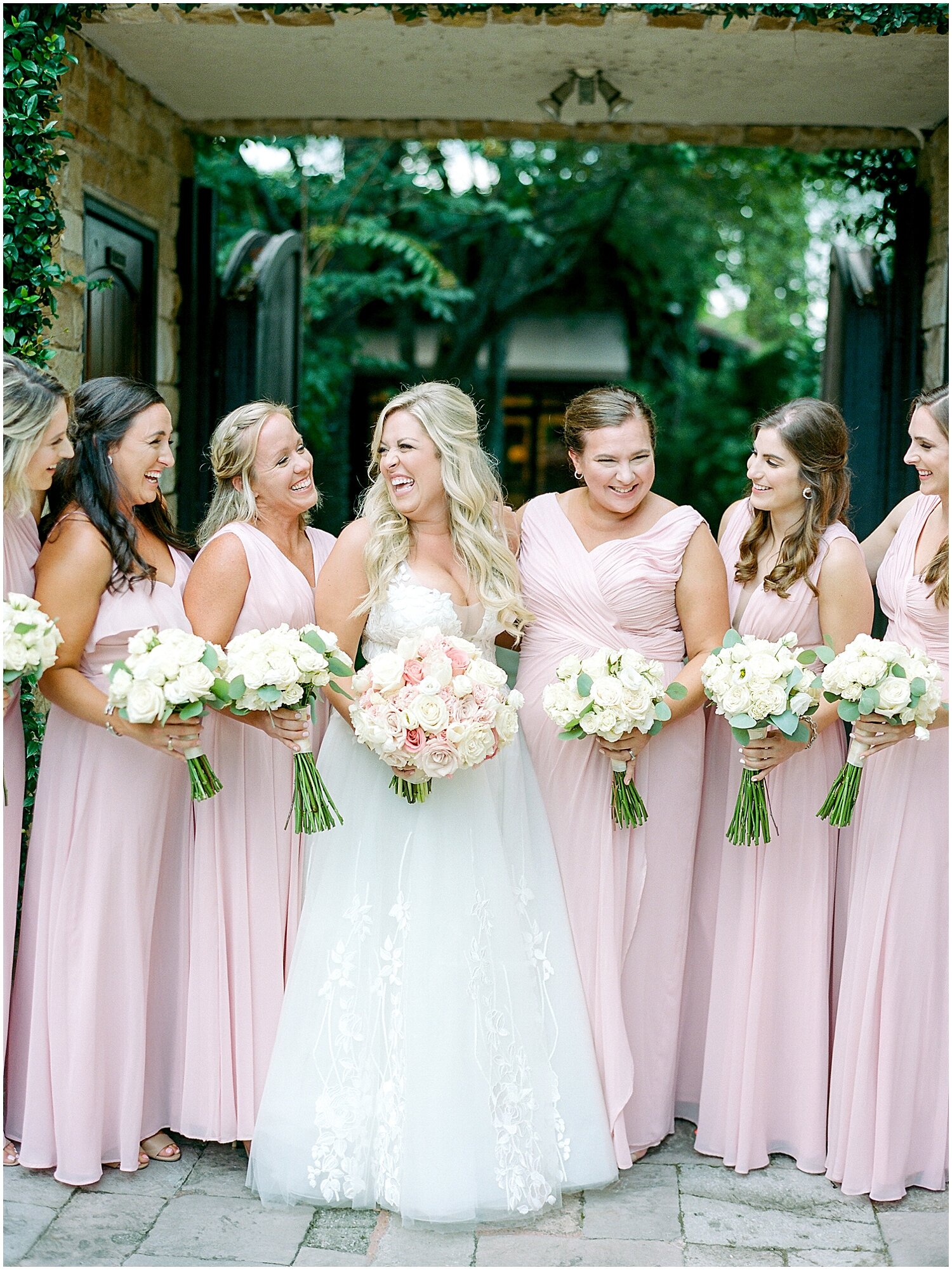  bride and bridesmaids holding their bridal bouquets 