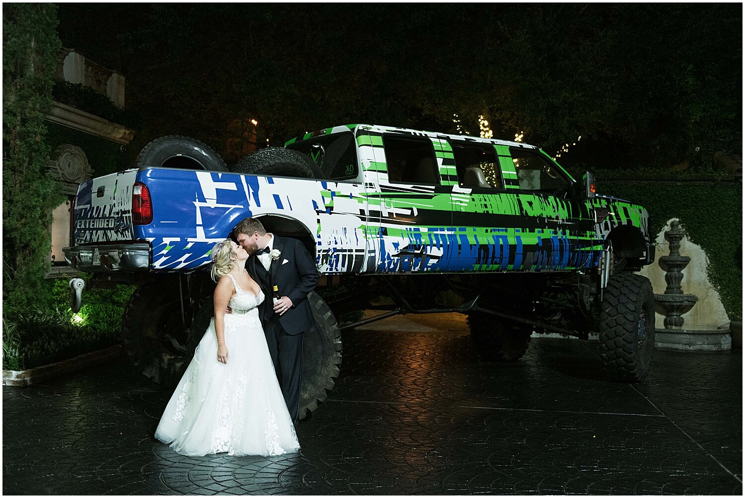  bride and groom in front of a monster truck 