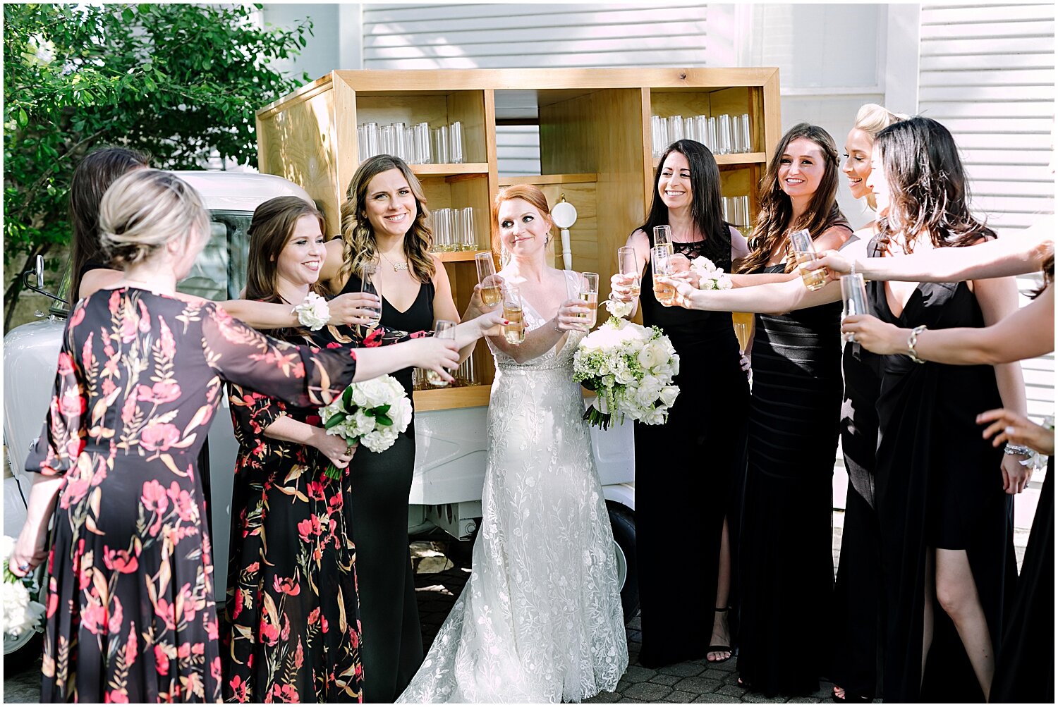 bride and bridesmaids making a toast 