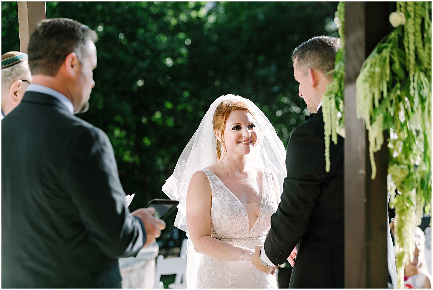  bride and groom during their outdoor wedding ceremony 
