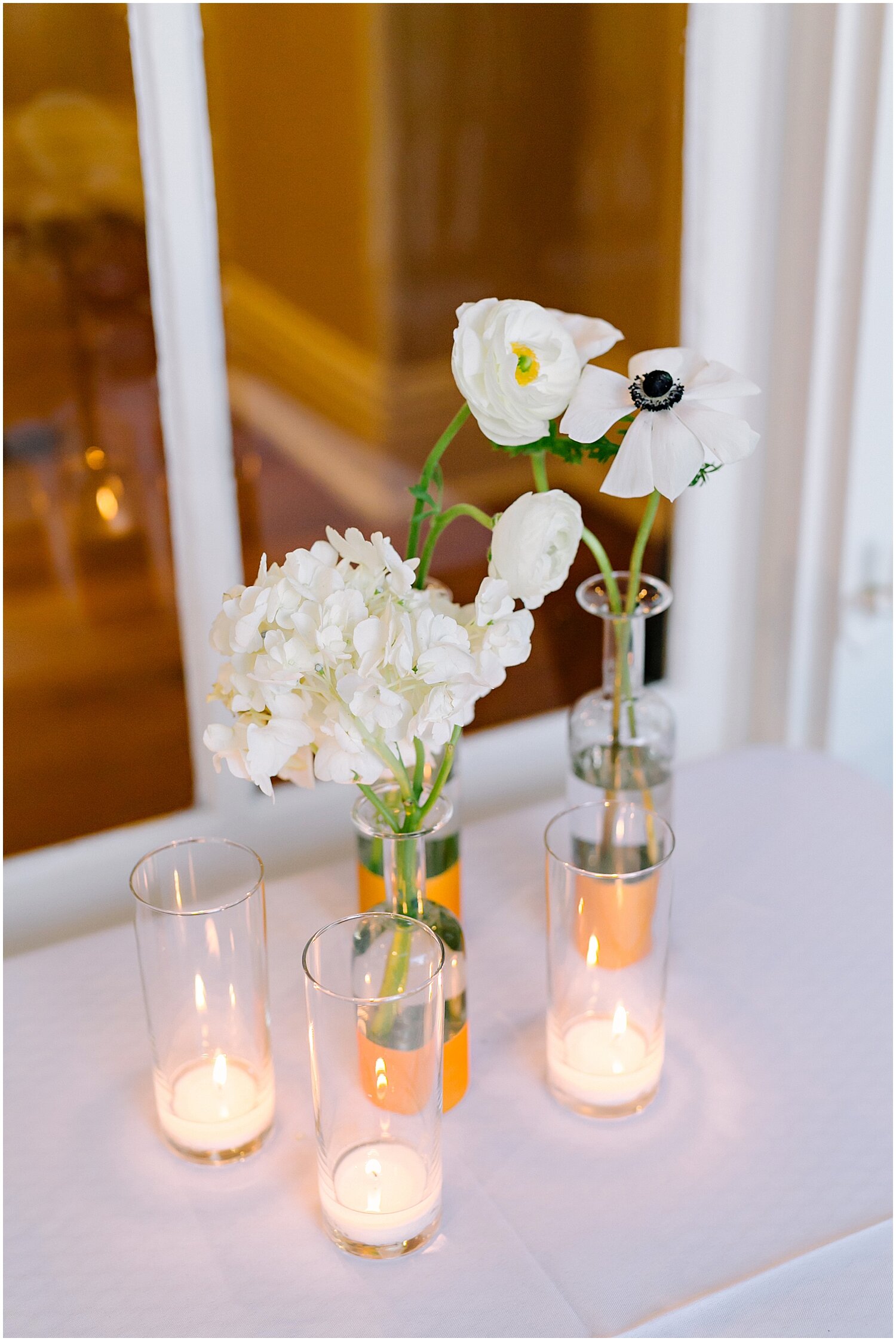  elegant candle and simple floral decor 