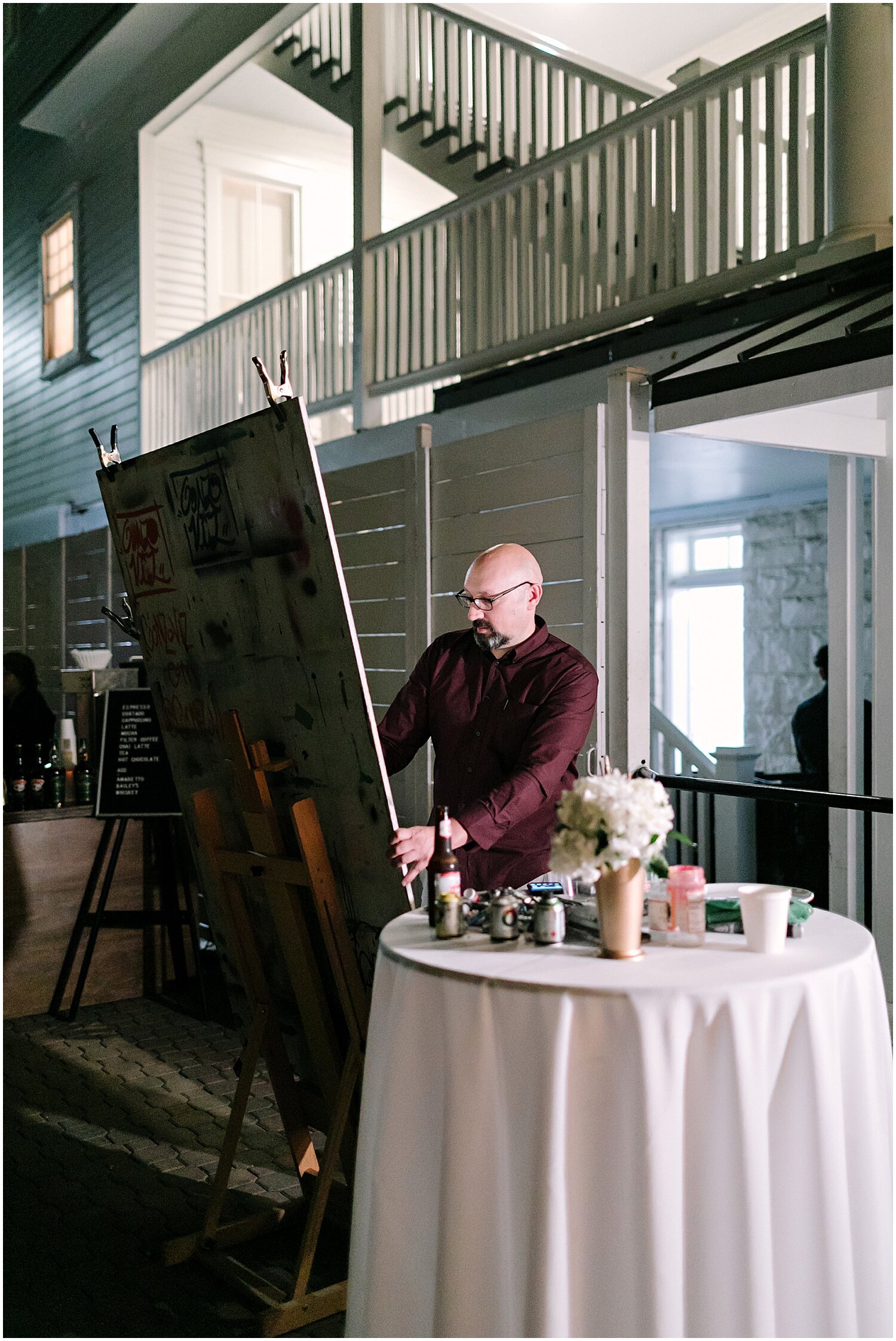  painter painting during wedding reception 