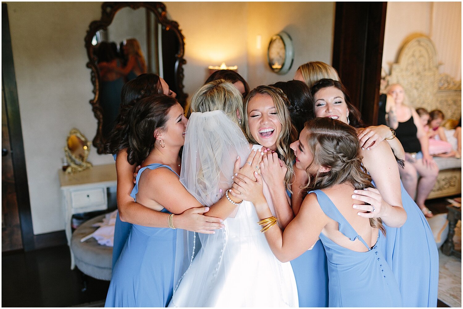  bride and bridesmaids hugging before the wedding 