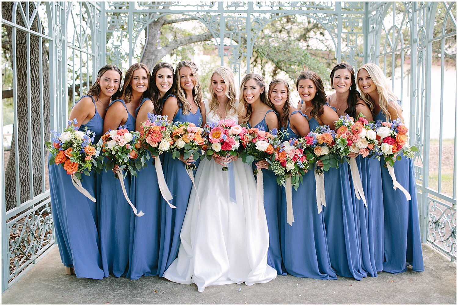  bride and bridesmaids holding their wedding bouquets 