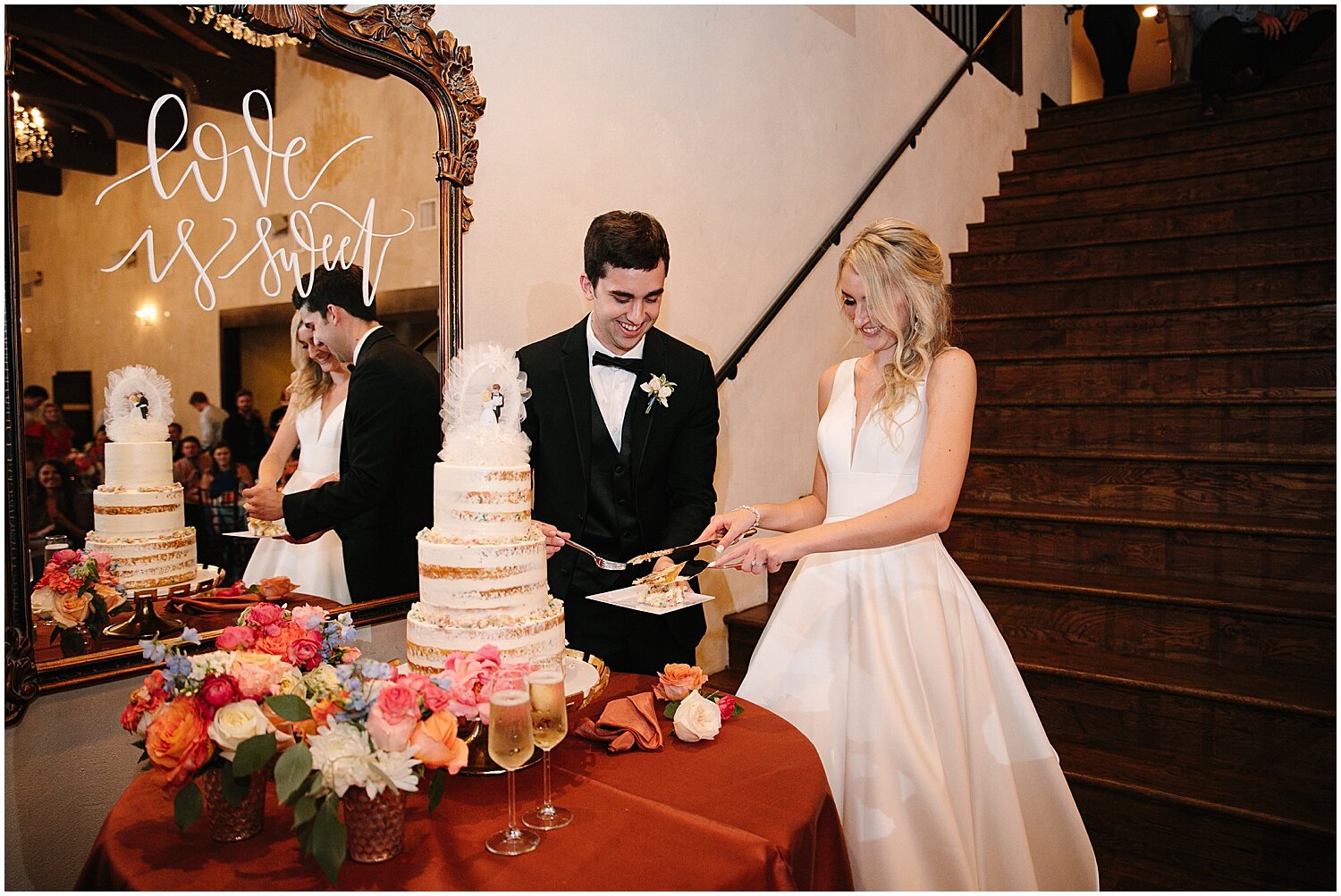  bride and groom cut their wedding cake  