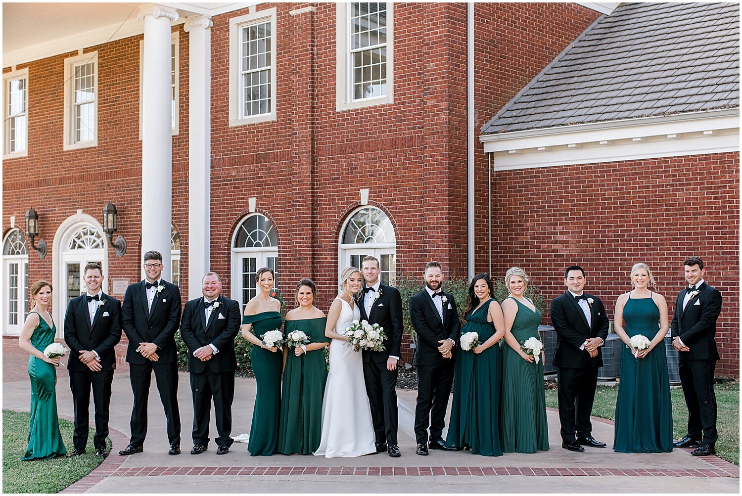  bride and groom with their wedding party 