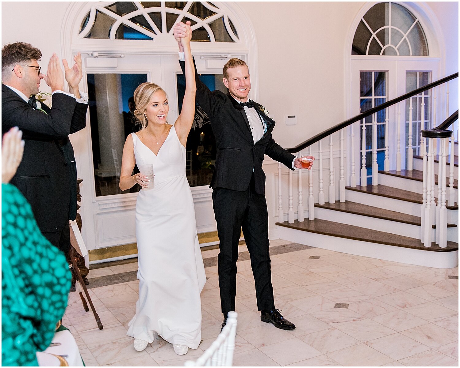  bride and groom enter their wedding reception 