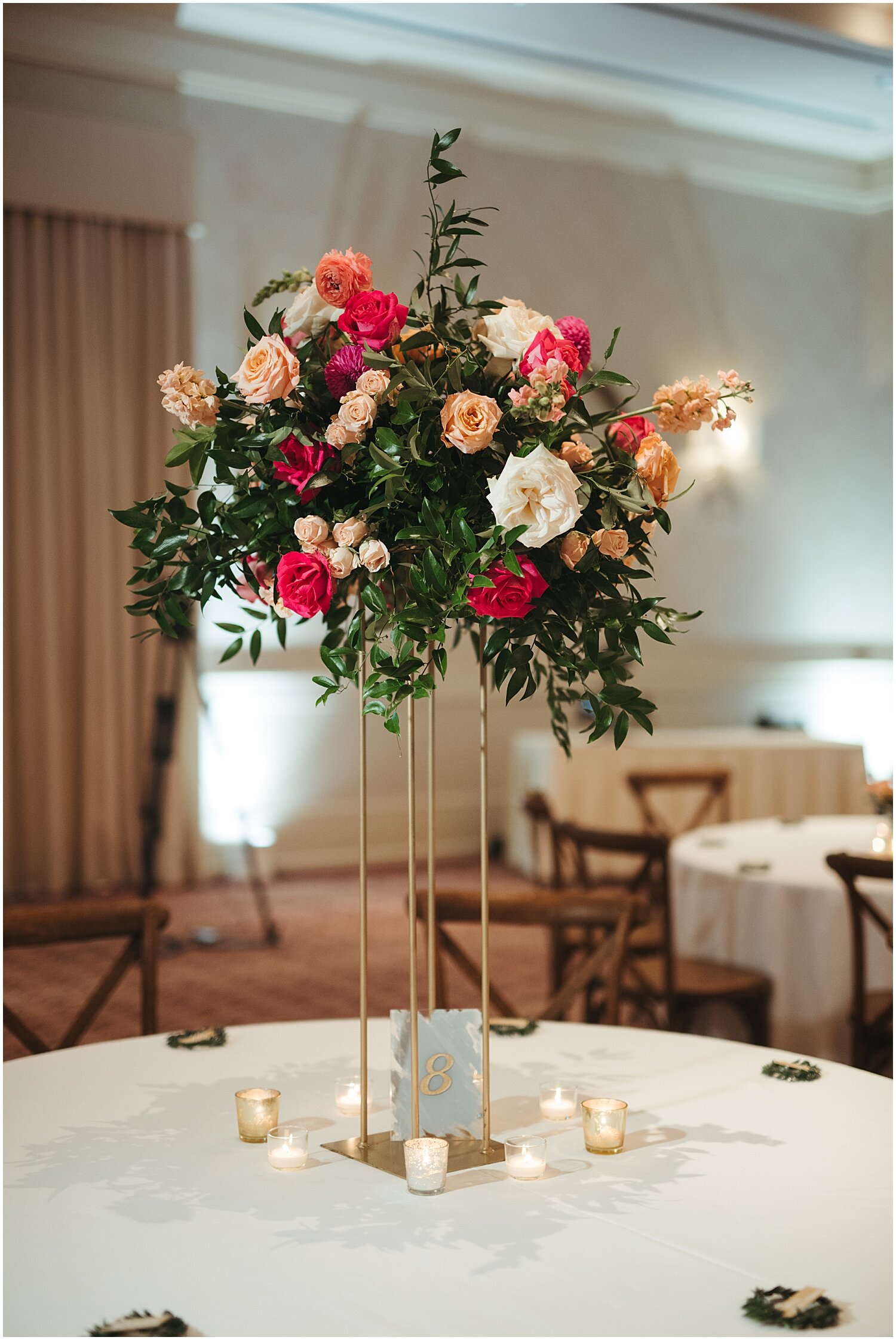  tall wedding centerpiece with pink floral and greenery decor 