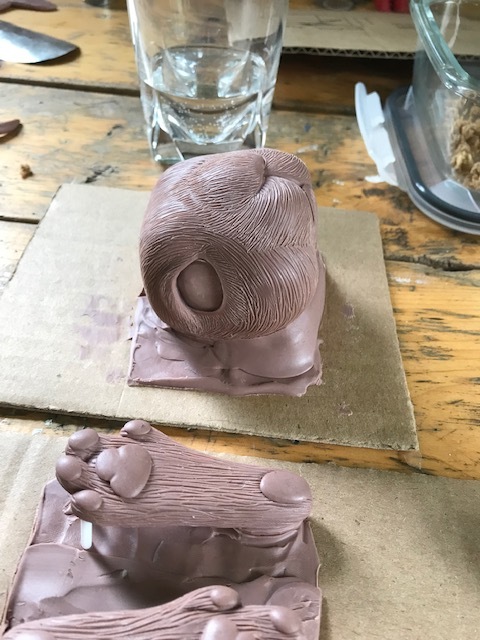 The sculpt for the face-plate and feet
